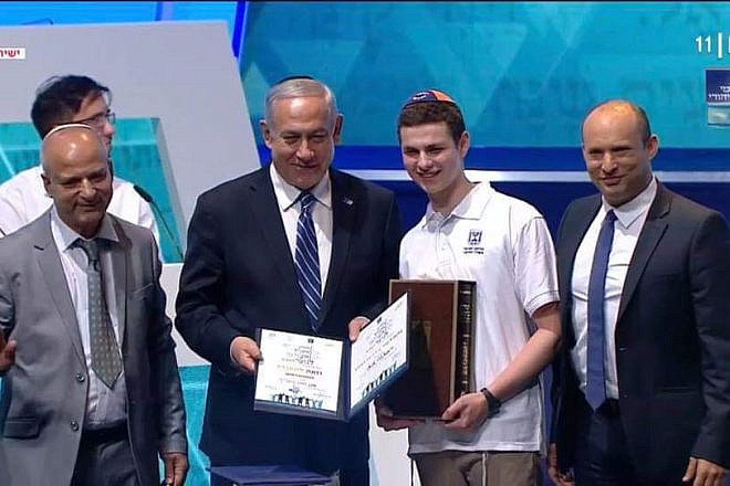 Jacob Colchamiro of Short Hills, N.J., who placed second in the world, is pictured with Israeli Prime Minister Benjamin Netanyahu. Credit: Screenshot.