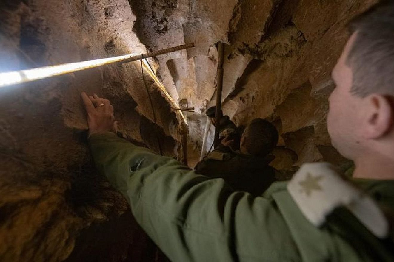 Israeli troops look into a tunnel discovered crossing between Lebanon and Israel. Credit: IDF.