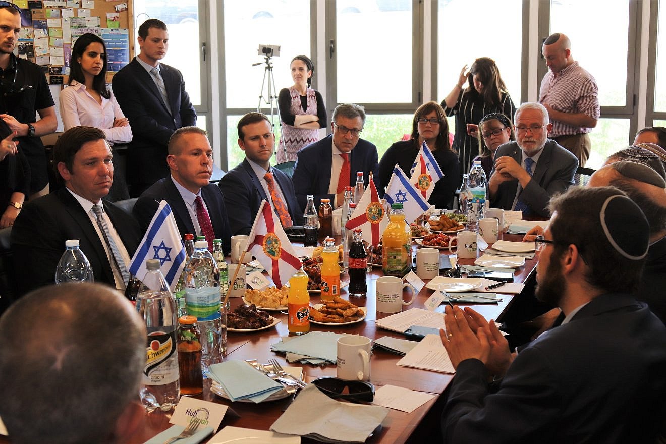 Florida Gov. Ron DeSantis (left) meets with Israeli Strategic Affairs Minister Gilad Erdan, as well as small-business owners and community leaders, at the Hub Etzion co-working space and small-business center in Gush Etzion on May 29, 2019. Credit: Shannon Nuszen.