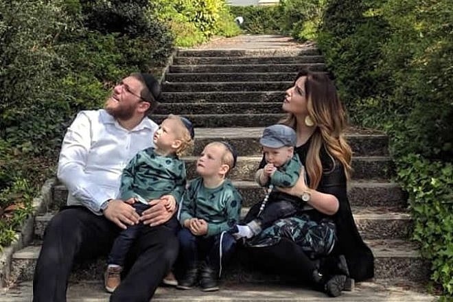 Rabbi Mordechai and Zlata Lewin, and their children, watch a military flyover in Normandy, France, site of the decisive Allied landing on D-Day that turned the tide of World War II. Credit: Chabad.org/News.