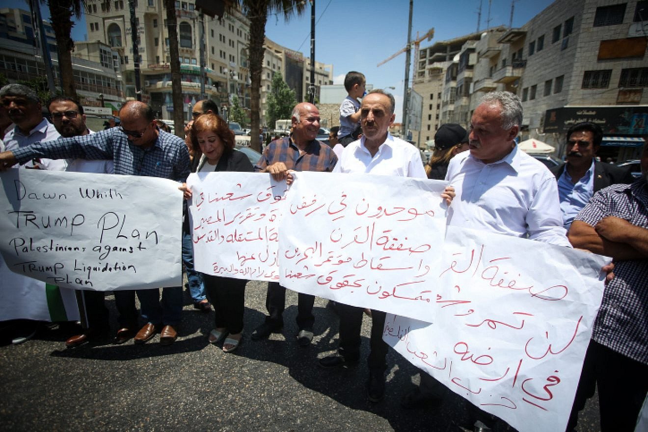 Palestinians demonstrate against the U.S.-led economic workshop being hosted by Bahrain this week, in the West Bank city of Ramallah, June 15, 2019. Photo by Flash90.