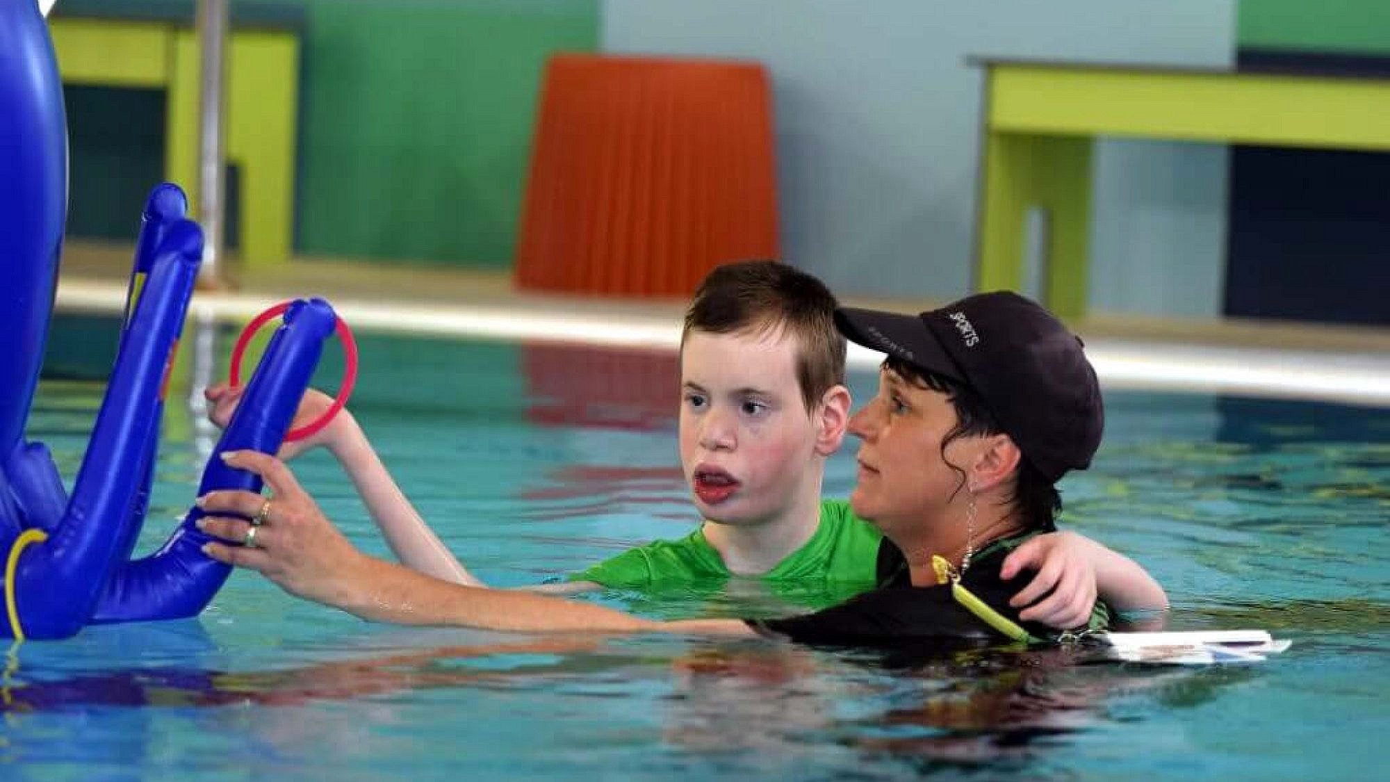 A hydrotherapist works with a resident with severe complex disabilities at the ALEH hydrotherapy pool in Jerusalem. Credit: ALEH.