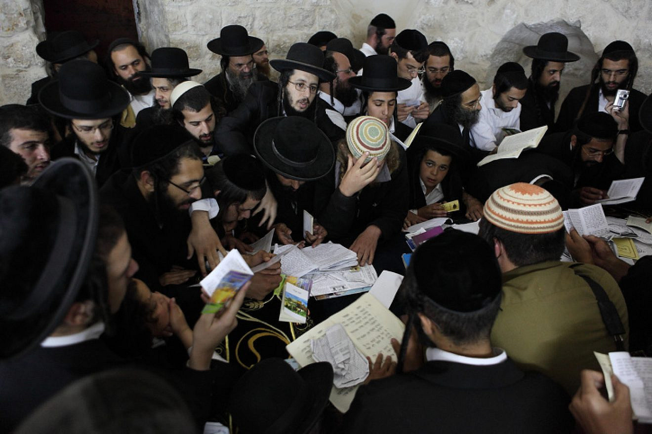 Jewish men pray at Joseph’s Tomb in Shechem/Nablus on July 4, 2011. Believed to be the final resting place of the biblical patriach Joseph, the area continually draws worshippers, who are often met by violence. Photo by Yaakov Naumi/Flash90.