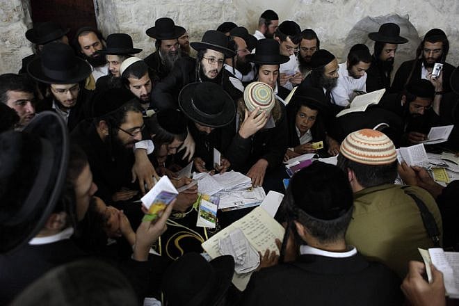 Jewish men pray at Joseph’s Tomb in Shechem/Nablus on July 4, 2011. Believed to be the final resting place of the biblical patriach Joseph, the area continually draws worshippers, who are often met by violence. Photo by Yaakov Naumi/Flash90.