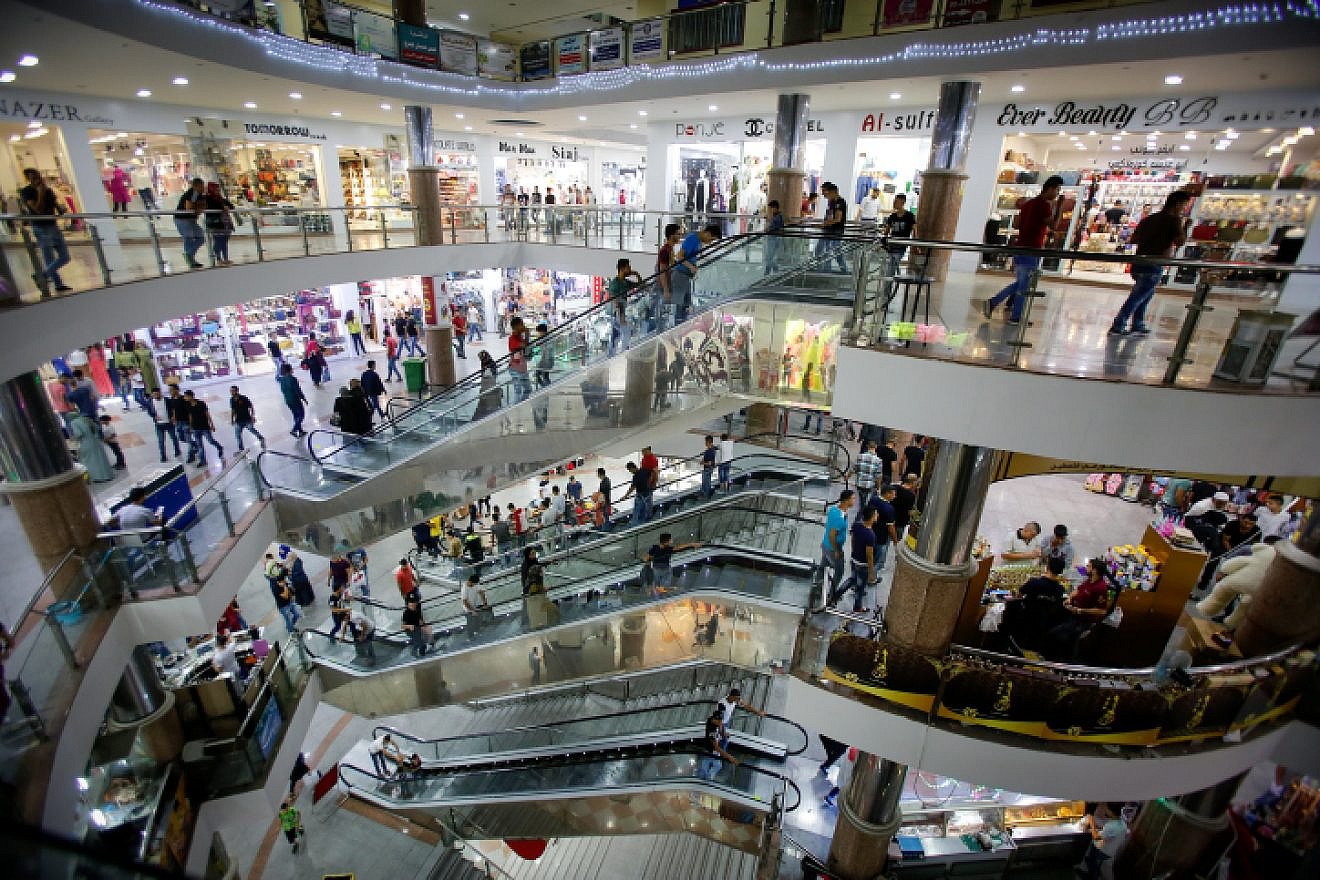 Palestinians shop at a mall in the West Bank city of Hebron on July 5, 2016. Photo by Wisam Hashlamoun/Flash90.