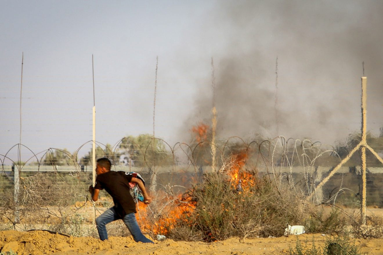 Palestinian rioters clash with Israeli security forces at the Israel-Gaza border, in the eastern part of Rafah, in the southern Gaza Strip on July 5, 2019. Photo by Abed Rahim Khatib/Flash90,