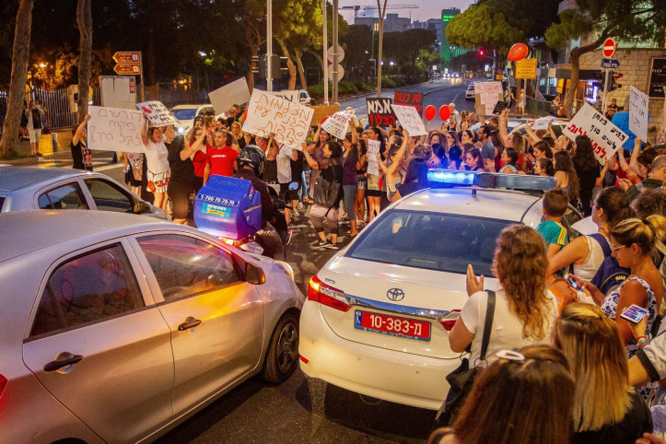Parents protest with their children against the lack of oversight in Israeli kindergartens, in Haifa, July 7, 2019. Photo by Flash90.