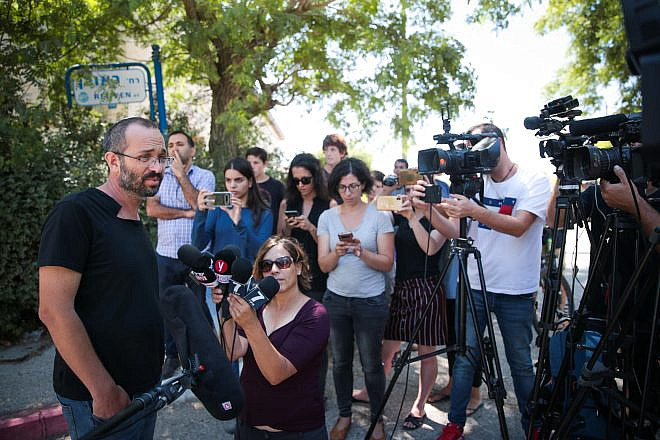 Yoav Sorek, the father of Dvir Sorek, the yeshivah student and IDF recruit who was found stabbed to death near the Jewish settlement of Migdal Oz in Gush Etzion, speaks with the media outside the family home in Ofra on Aug. 9, 2019. Photo by Flash90.