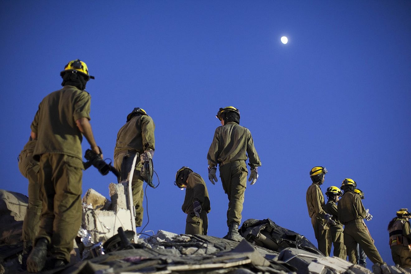 IDF Home Front Command soldiers take part in a drill simulating a building collapse following a chemical missile attack in Jerusalem on Aug. 27, 2012. Photo by Yonatan Sindel/Flash90.