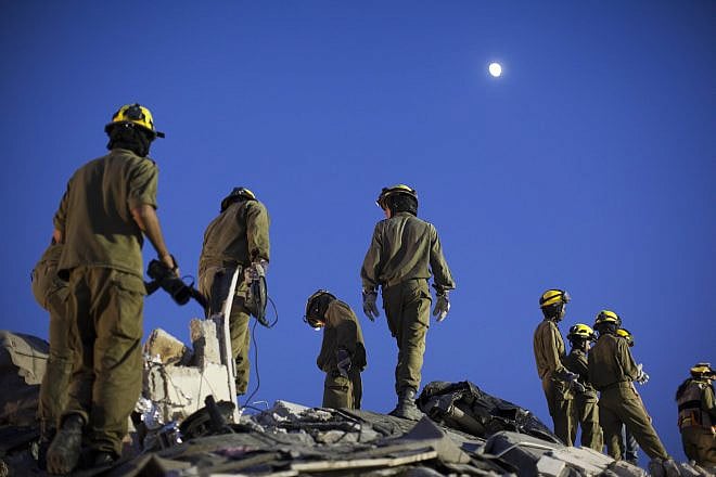 IDF Home Front Command soldiers take part in a drill simulating a building collapse following a chemical missile attack in Jerusalem on Aug. 27, 2012. Photo by Yonatan Sindel/Flash90.