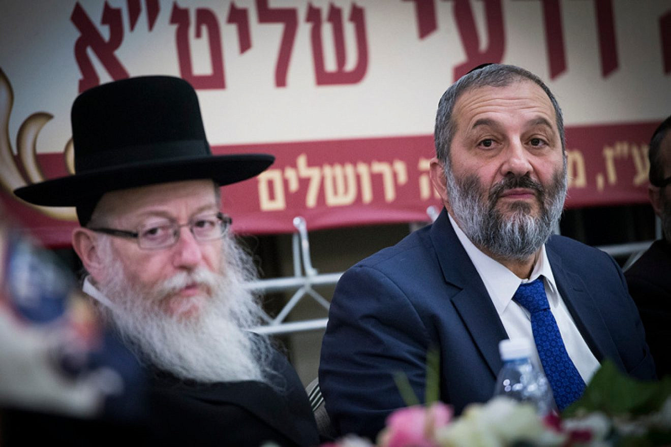 UTJ Party head Yaakov Litzman (left) and Shas Party leader Aryeh Deri attend a conference at the Ramada Jerusalem Hotel on Feb. 16, 2017. Photo by Yonatan Sindel/Flash90.