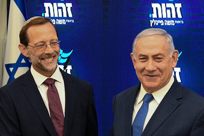 Israeli Prime Minister Benjamin Netayahu and Zehut Party leader Moshe Feiglin hold a joint press conference at Kfar Hamacabiah in Ramat Gan on Aug. 29, 2019. Photo by Flash90.
