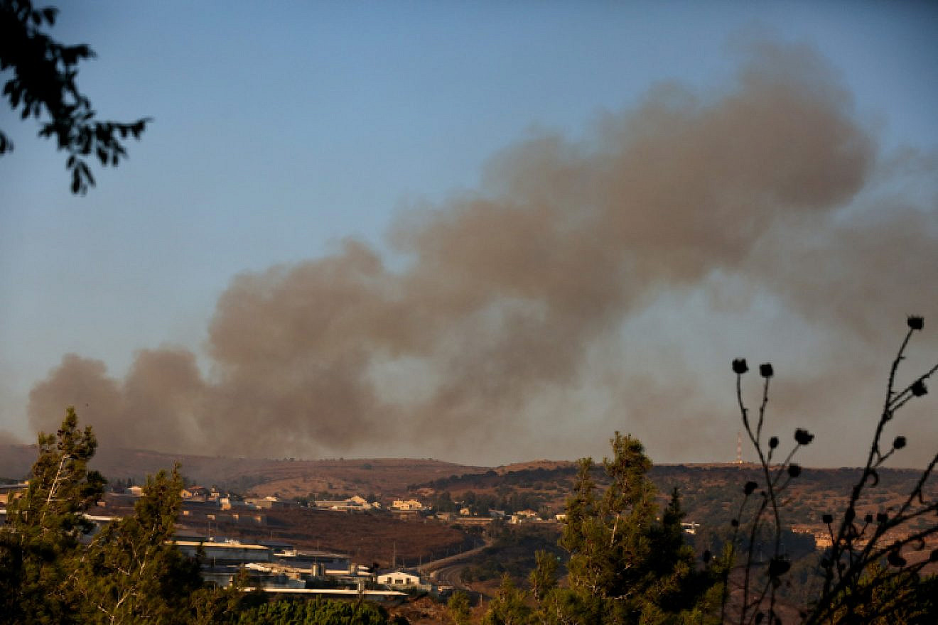 Smoke rises from a fire caused from a rocket fired from Lebanon by Hezbollah, near Moshav Avivim in northern Israel, Sept. 1, 2019. Photo by David Cohen/Flash90.