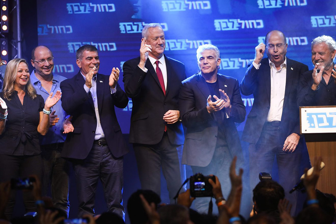 Blue and White Party chairman Benny Gantz with party members at campaign headquarters on election night in Tel Aviv, Sept. 18, 2019. Photo by Hadas Parush/Flash90.
