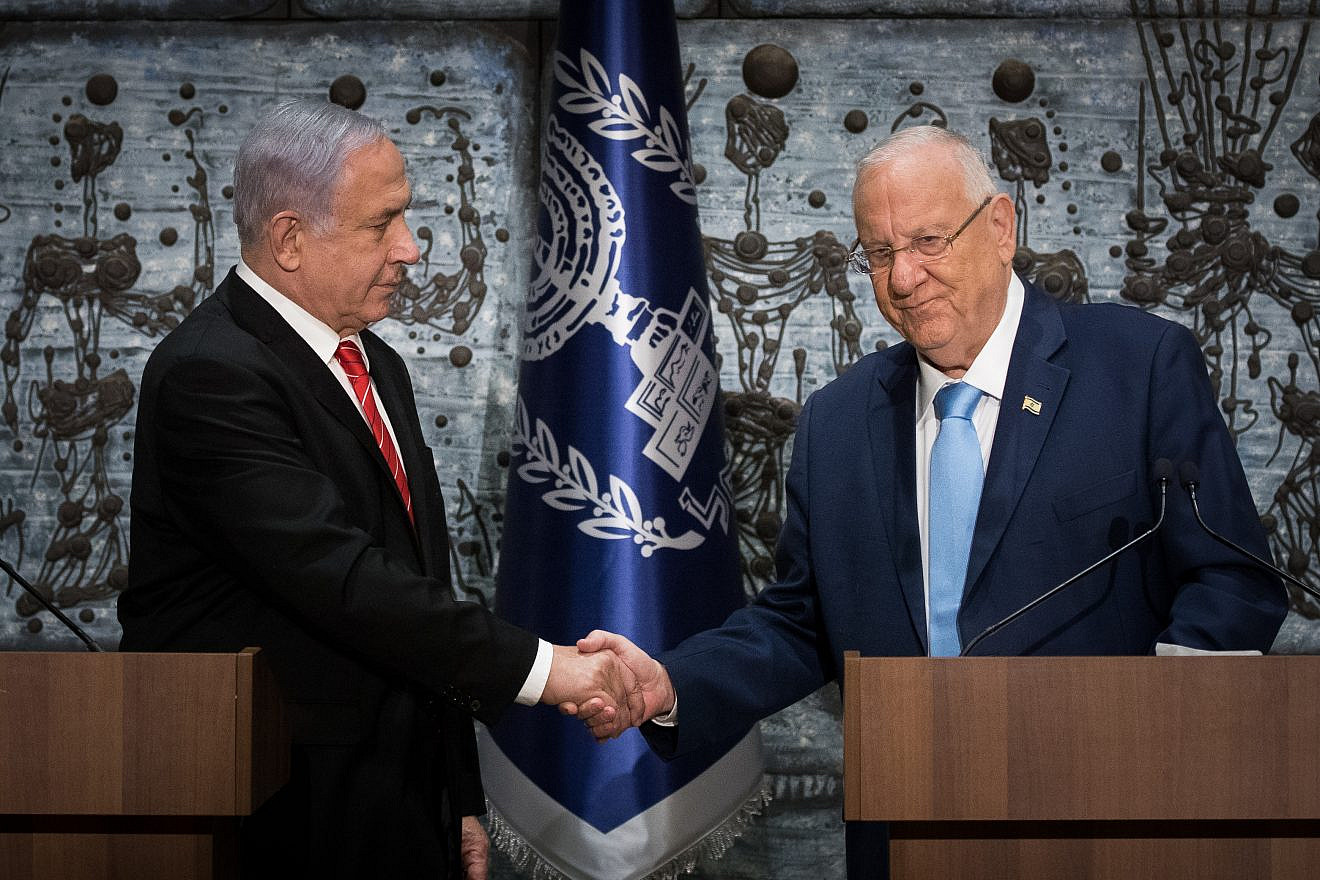 Israeli President Reuven Rivlin presents Israeli Prime Minister Benjamin Netanyahu with the mandate to form a new government following the Sept. 17 general elections that nearly repeated the April 9 results, at the President's Residence in Jerusalem, Sept. 25, 2019. Photo by Yonatan Sindel/Flash90.
