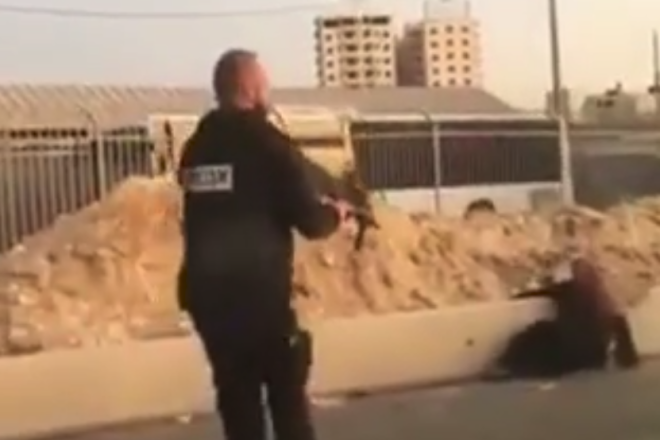 A Palestinian woman lies on the ground after being shot in the leg by a security guard at the Qalandia checkpoint outside Jerusalem on Sept. 18, 2019. Source: Screenshot.