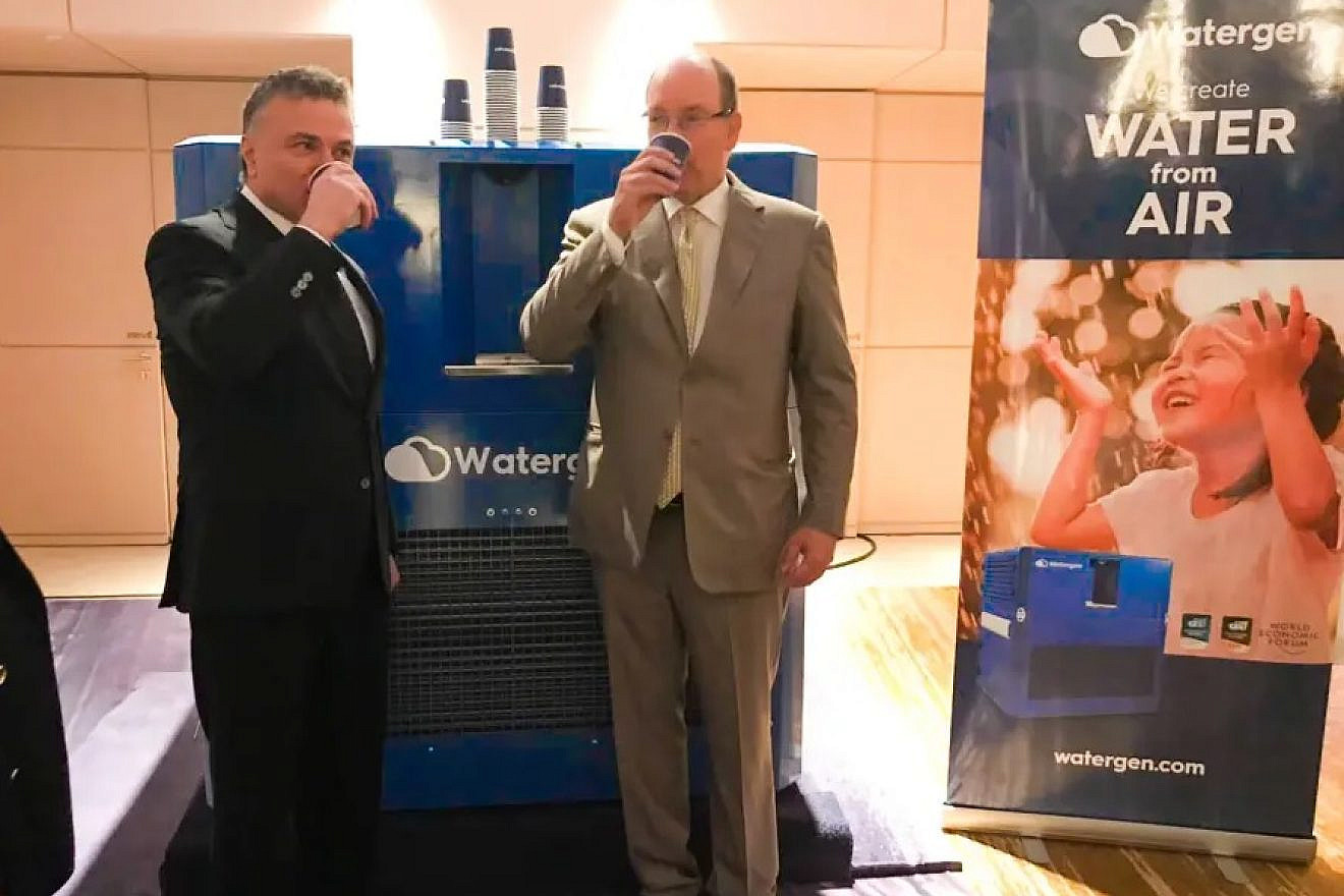 Monaco's Prince Albert II and Dr. Michael Mirilashvili drinking from Watergen's system. Credit: Watergen.