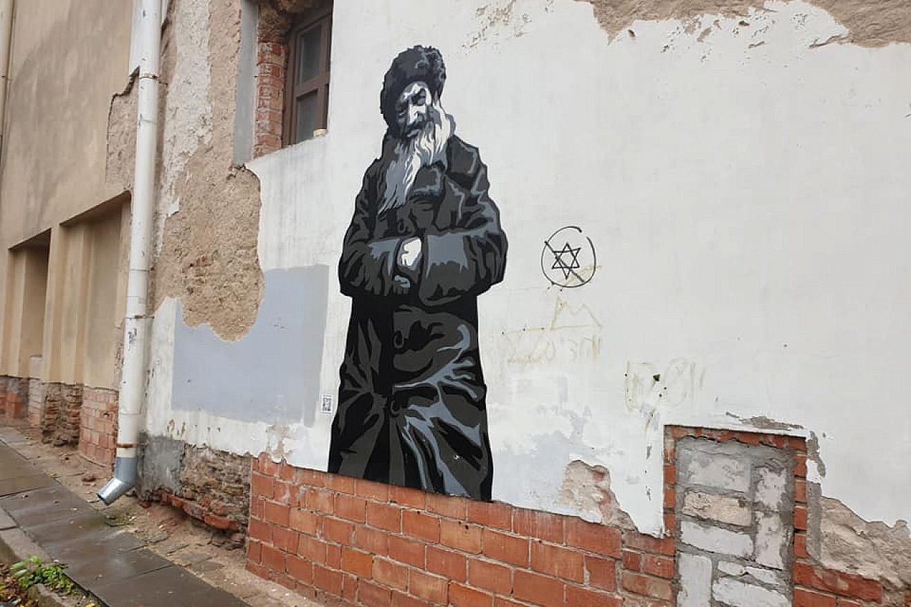 Anti-Semitic graffiti found on a wall mural commemorating Jewish life in Vilnius, Lithuania. Source: Facebook.