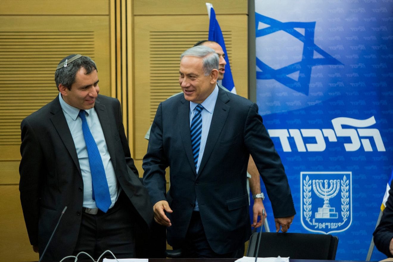Israeli Prime Minister Benjamin Netanyahu speaks with Immigrant Absorption Minister Ze'ev Elkin during a Likud Party meeting at the Knesset, on May 18, 2015. Photo by Yonatan Sindel/Flash90.