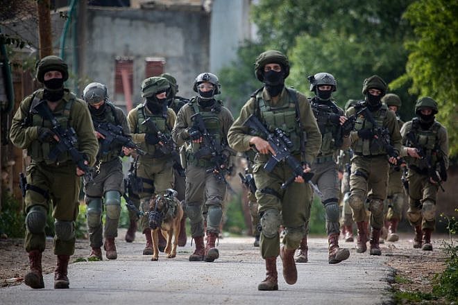 Illustrative: Israeli soldiers seen during a raid in the West Bank on March 17, 2019. Photo by Flash90.