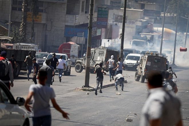 Israeli forces clash with Palestinians during a security raid in the West Bank city of Ramallah on Sept. 25, 2019. Photo by Flash90.