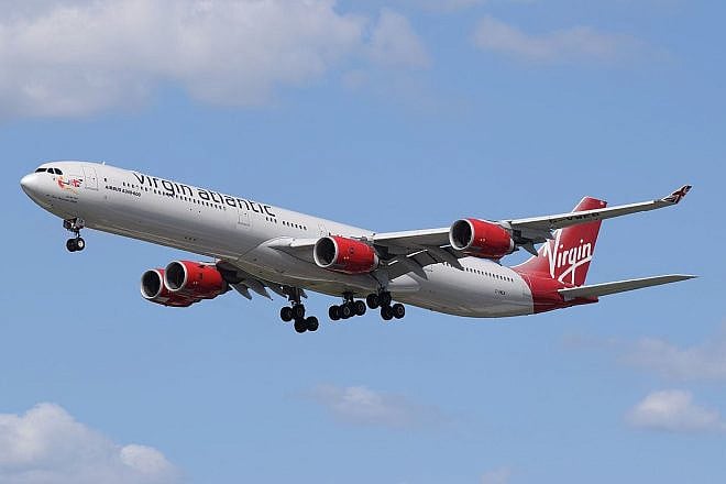 A Virgin Atlantic jet lands at London's Heathrow Airport, on June 7, 2015. Photo by Adrian Pingstone via Wikimedia Commons.