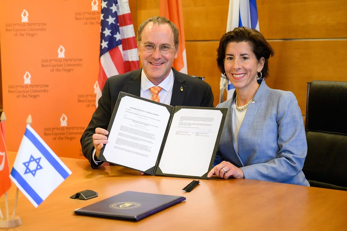 Rhode Island Gov. Gina Raimondo and Professor Daniel Chamovitz, president of Ben-Gurion University of the Negev, sign a Memorandum of Understanding (MoU) between the state and the university. Credit: Courtesy.