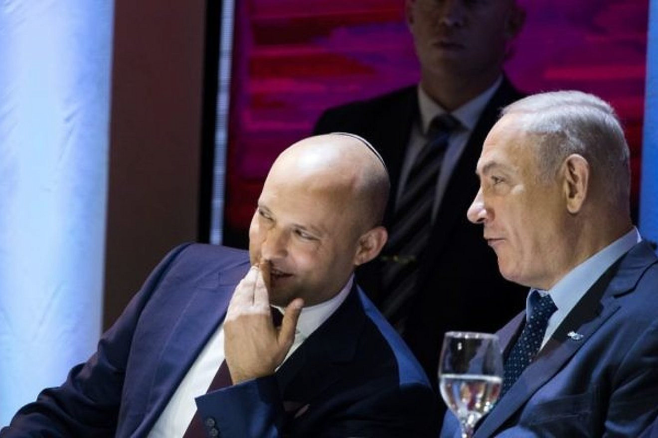 Former Education Minister Naftali Bennett (left) speaks with Israeli Prime Minister Benjamin Netanyahu during the Israel Prize award ceremony at the International Conference Center in Jerusalem on May 2, 2017. Photo by Yonatan Sindel/Flash90.