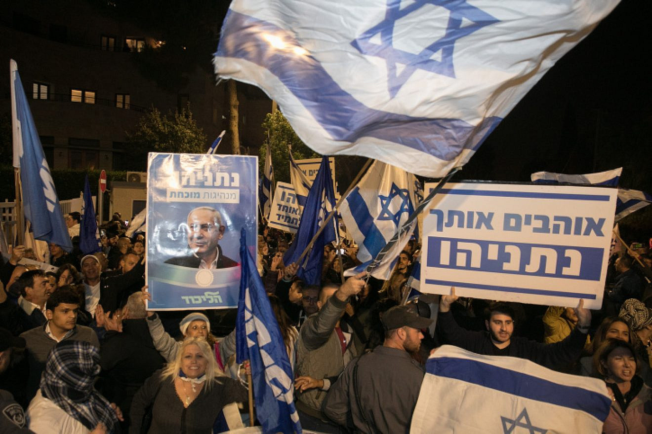 Supporters of Israeli Prime Minister Benjamin Netanyahu show their support outside the Prime Minister's Residence in Jerusalem, following the announcement by Attorney General Avichai Mandelblit that the premier will stand trial for bribery, fraud and breach of trust, Nov. 23, 2019. Photo by Olivier Fitoussi/Flash90.