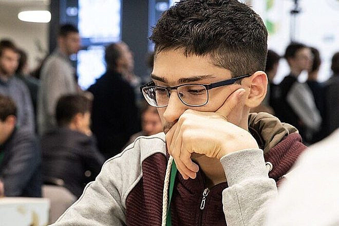 Iranian chess prodigy Alireza Firouzja on the World Rapid and Blitz 2018, Dec. 27, 2018. Credit: Leonid Fleischman via Wikimedia Commons.