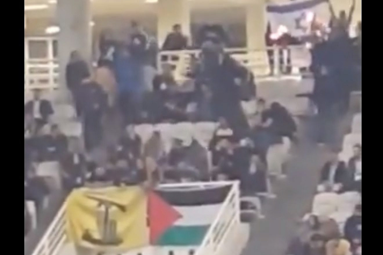 Fans of the Greek basketball team AEK Athens waved Hezbollah and Palestinian flags, and burned an Israeli flag during a game with the Israeli team Hapoel Jerusalem in Athens. Source: Screenshot.