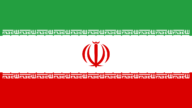 An Iranian flag. Credit: Hamid Nadimi via Wikimedia Commons.