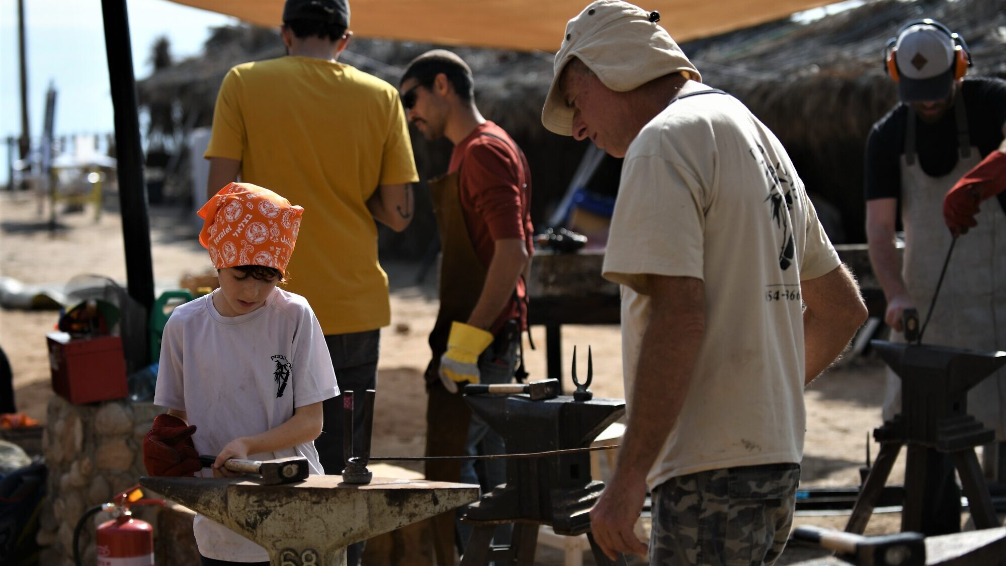 Children learn to use different tools and crafts from students in the Department of Industrial Design at Bezalel Academy in Jerusalem as part of the annual Dead Sea Seminar, February 2020. Photo by Avgar Idan.
