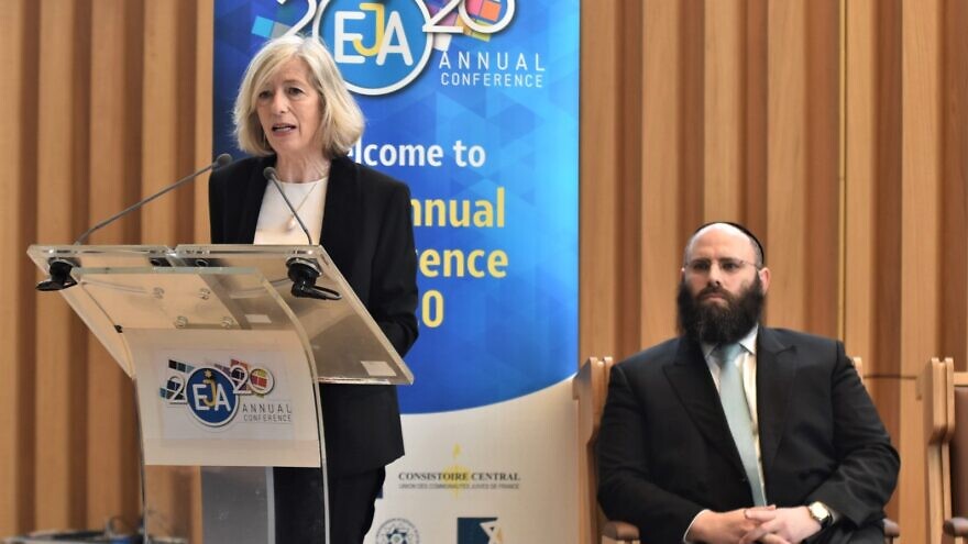 UNESCO assistant director-general Stefania Giannini speaks at the European Jewish Association’s (EJA) annual policy conference in Paris; seated is EJA chairman Rabbi Menachem Margolin, Feb. 24, 2020. Photo by Yoni Rykner.
