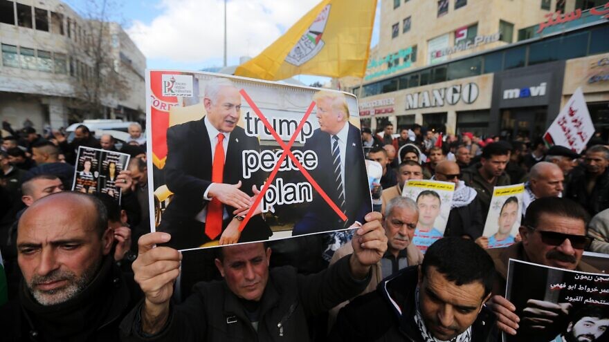 Palestinian demonstrators protest against U.S. President Donald Trump's Mideast peace plan in Hebron on Jan. 30, 2020. Photo by Wisam Hashlamoun/Flash90.