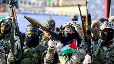 Palestinian terrorists participate in an anti-Israel rally in Khan Yunis in the southern Gaza Strip, on Feb. 17, 2020. Photo by Abed Rahim Khatib/Flash90.