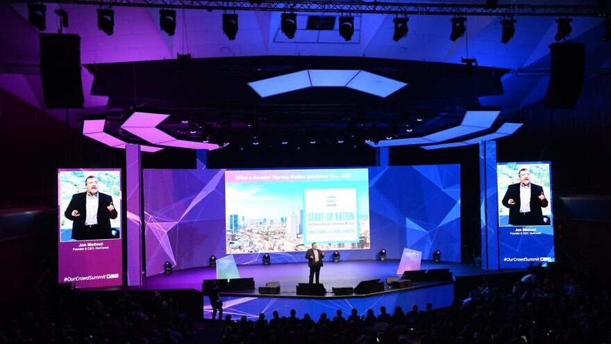 OurCrowd founder and CEO Jonathan Medved speaks to 2,500 people gathered for OurCrowd’s 2020 global investor summit in Jerusalem, Feb. 13, 2020. Credit: Courtesy.