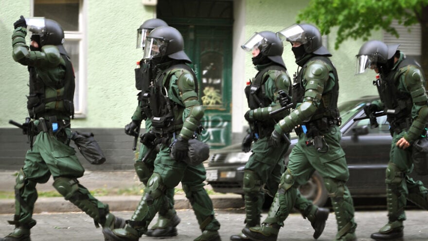 German police on a raid. Credit: Jay P. Lee via Flickr.