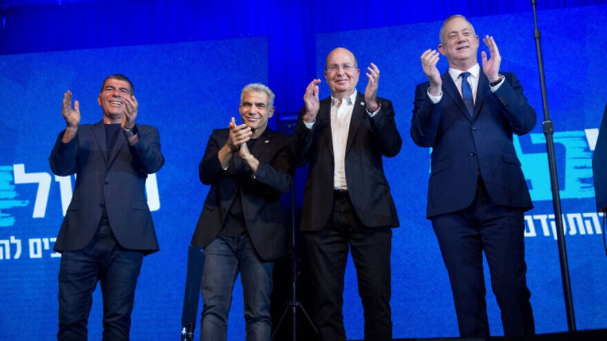 Blue and White Party leader Benny Gantz (far right) with party co-leaders Moshe Ya'alon (second from right), Yair Lapid (second from left) and Gabi Ashkenazi, at party headquarters in Tel Aviv, on election night, March 3, 2020. Photo by Miriam Alster/Flash90.