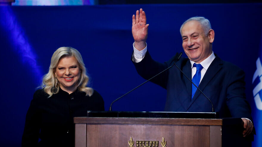Israeli Prime Minister Benjamin Netanyahu and his wife, Sara, address their supporters on Israeli election night at Likud Party headquarters in Tel Aviv, March 3, 2020. Photo by Olivier Fitoussi/Flash90.