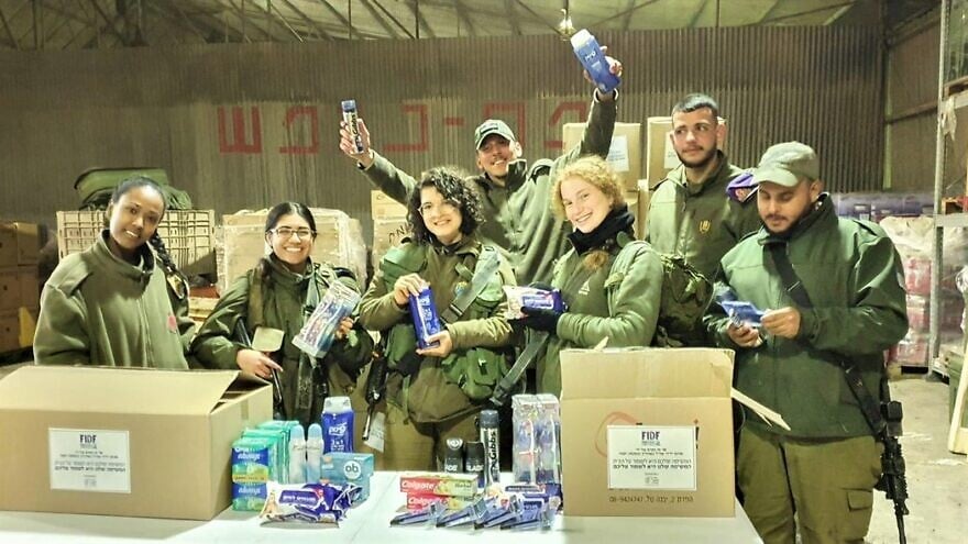 Israeli soldiers on base receiving hygiene kits and other packages while stationed there due to the coronavirus from Friends of the Israel Defense Forces. Credit: FIDF.