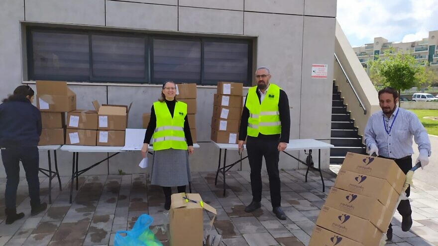 Barkai Center for Practical Rabbinics and Community Development volunteers organize the delivery of food packages in Modi'in, Israel, March 2020. Credit: Courtesy.