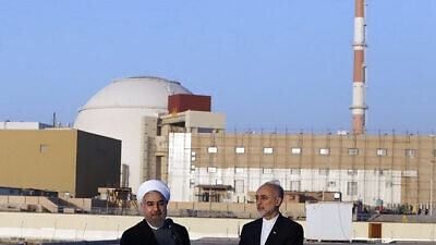 Iranian President Hassan Rouhani (left) and head of the Atomic Energy Organization of Iran (AEOI) Ali Akbar Salehi near the Bushehr nuclear plant, on Jan. 13, 2015. Credit: Hossein Heidarpour via Wikimedia Commons.