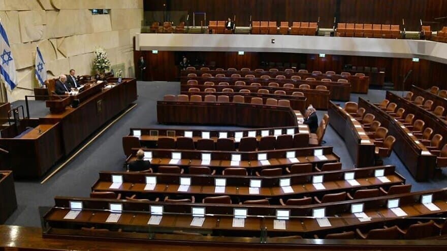 Israeli President Reuven Rivlin addresses a largely empty Knesset for the swearing-in of the 23rd Knesset. Present is Israeli Prime Minister Benjamin Netanyahu, Blue and White leader Benny Gantz, Knesset speaker Yuli Edelstein and Supreme Court president Esther Hayut on March 16, 2020. Photo by Haim Zach/GPO.