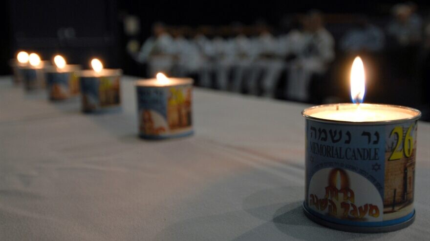Six memorial candles were lit on board the Naval Station Pearl Harbor during the opening remarks of a remembrance observation to commemorate the lives of more than 6 million Jews lost during the Holocaust, April 26, 2007. U.S. Navy Photo by Mass Communication Specialist 1st Class James E. Foehl.