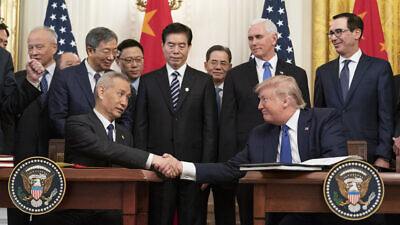 U.S. President Donald Trump, joined by Chinese Vice Premier Liu He, sign the U.S. China Phase One Trade Agreement in the East Room of the White House on Jan. 15, 2020. Official White House Photo by Shealah Craighead.
