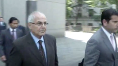 Peter Madoff, brother of disgraced financier Bernie Madoff, walks out of a federal courthouse in New York on June 29, 2012, after pleading guilty to charges of conspiracy and fabricating investment records as part of his brother's Ponzi scheme. He was released from federal custody on Aug. 13, 2020. Source: Screenshot.