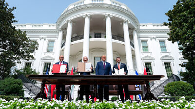 Then-U.S. President Donald Trump, Bahrain Foreign Minister Abdullatif bin Rashid Al Zayani, Israeli Prime Minister Benjamin Netanyahu and UAE Foreign Minister Abdullah bin Zayed Al Nahyan sign the Abraham Accords on the South Lawn of the White House, Sept. 15, 2020. Credit: White House/Tia Dufour.