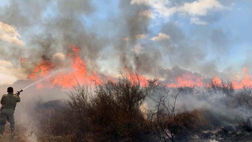 Israeli firefighters battling the damage caused by Hamas arson attacks. Source: Twitter/IDF.