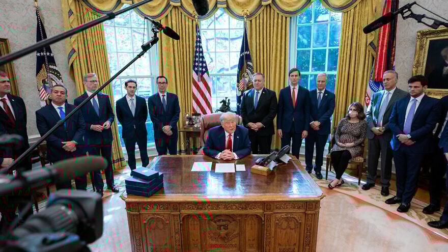 U.S. President Donald Trump, joined by White House senior advisers, announces the normalization of relations between Sudan and Israel on Oct. 23, 2020, in the Oval Office of the White House. Credit: Tia Dufour/The White House.